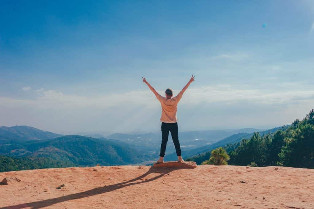 Woman standing on cliff